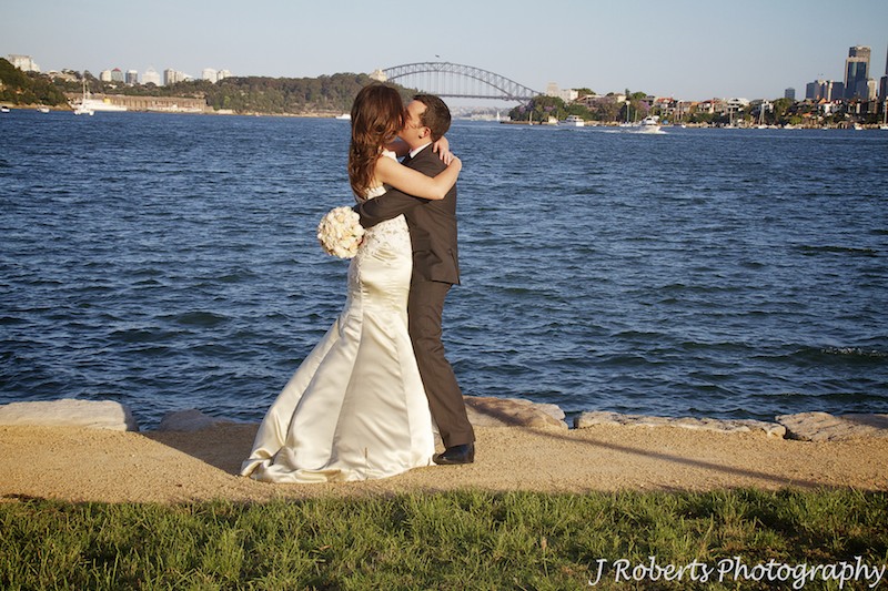 Couple kissing at Clarkes Point Woolwich = wedding photography sydney